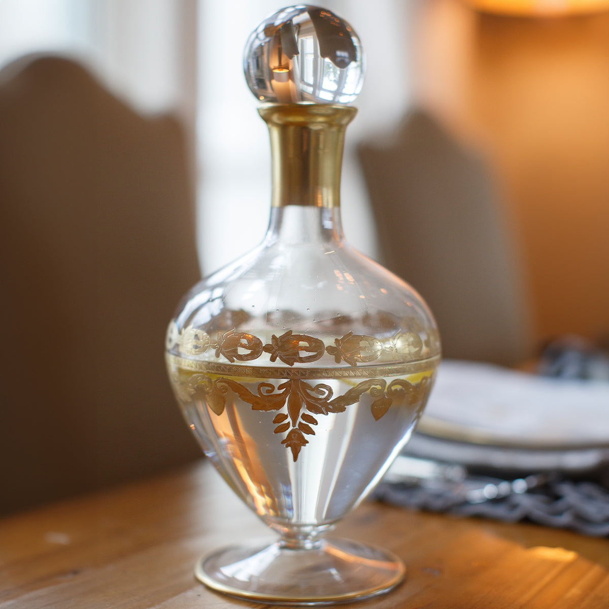 Good Clear glass decanter with gold trimmed stopper